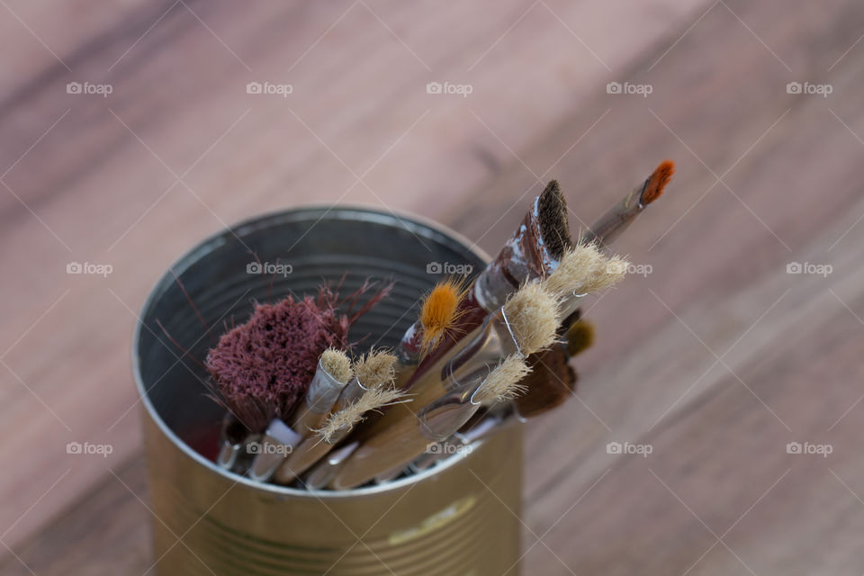 Close-up of paintbrush in container