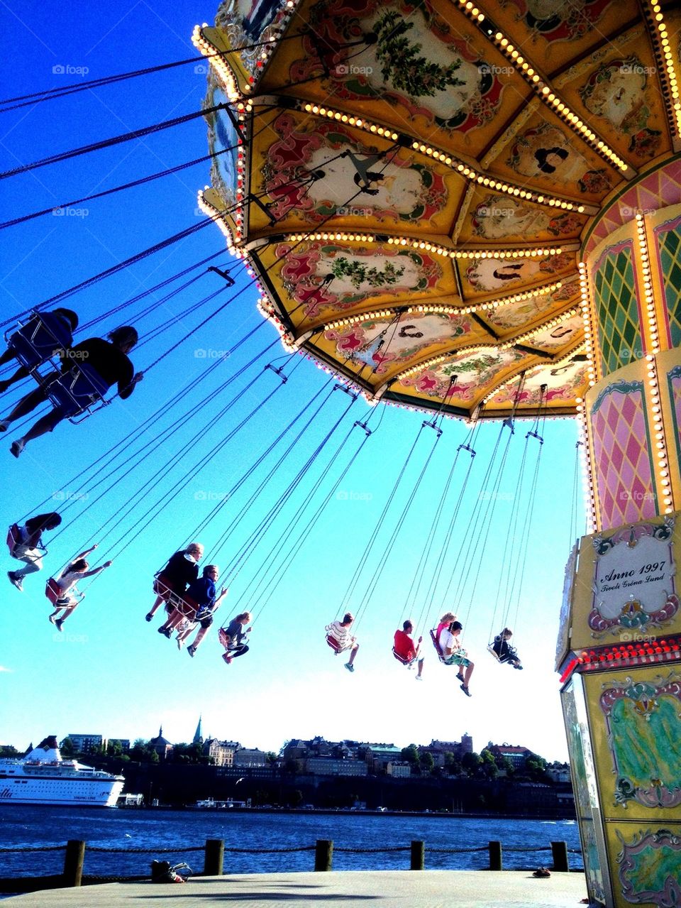 People enjoying carousel ride