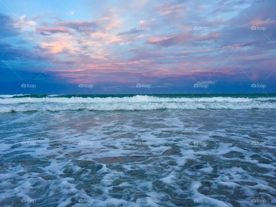Miami beach surf at sunset 