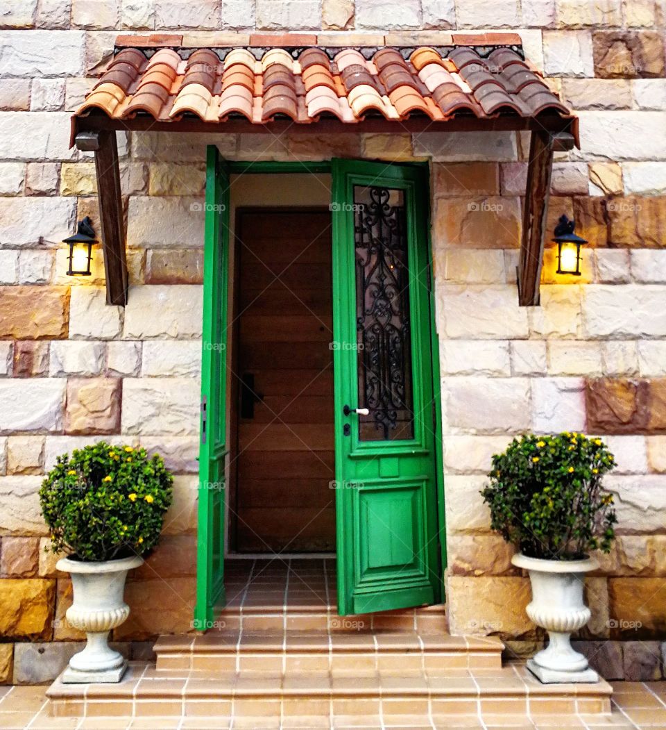 Italian styled villa with door entrance