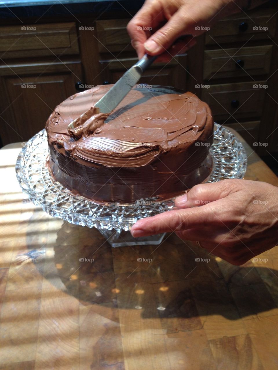 CAKE Being Frosted By Hand