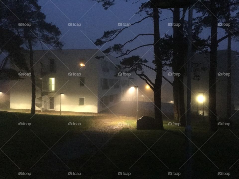 Building next to a park in the night 
