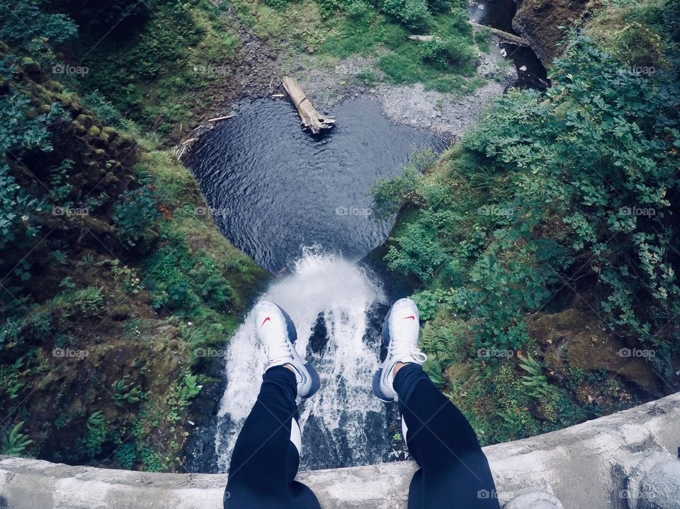 Sitting on the edge at Multnomah Falls in Oregon.