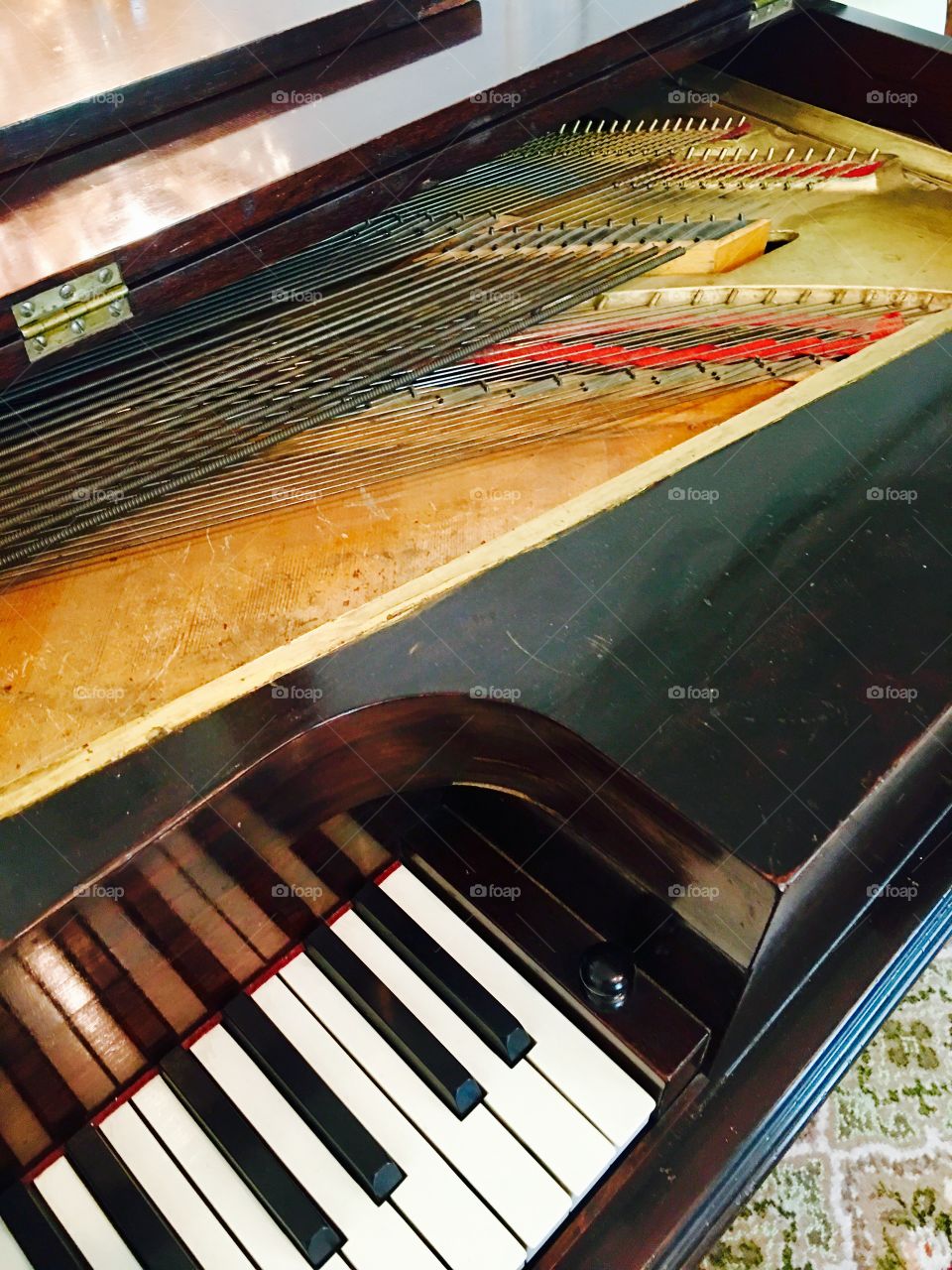 Music historical piano. Strings. Keys. Antique.