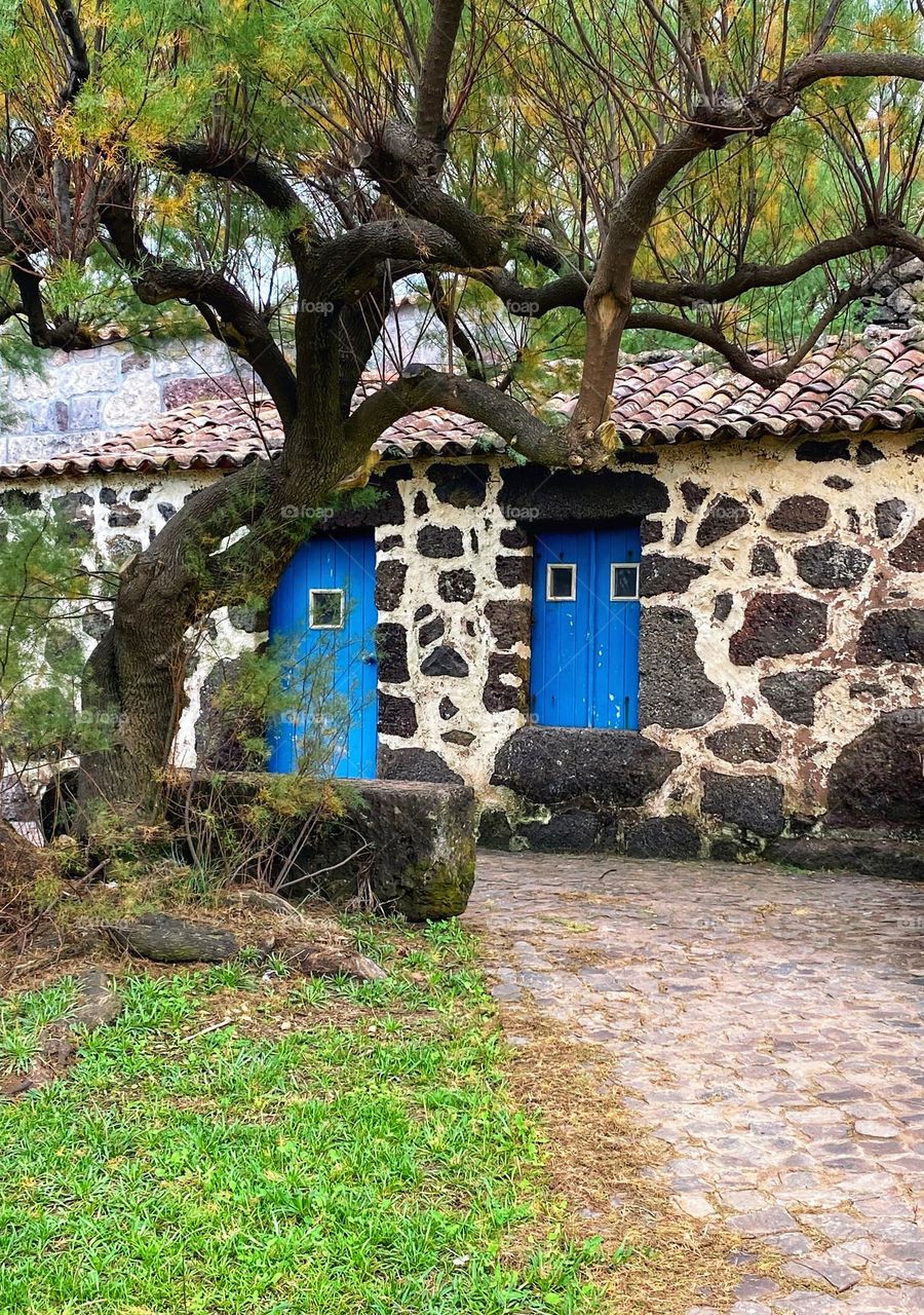 Old house with blue wooden doors