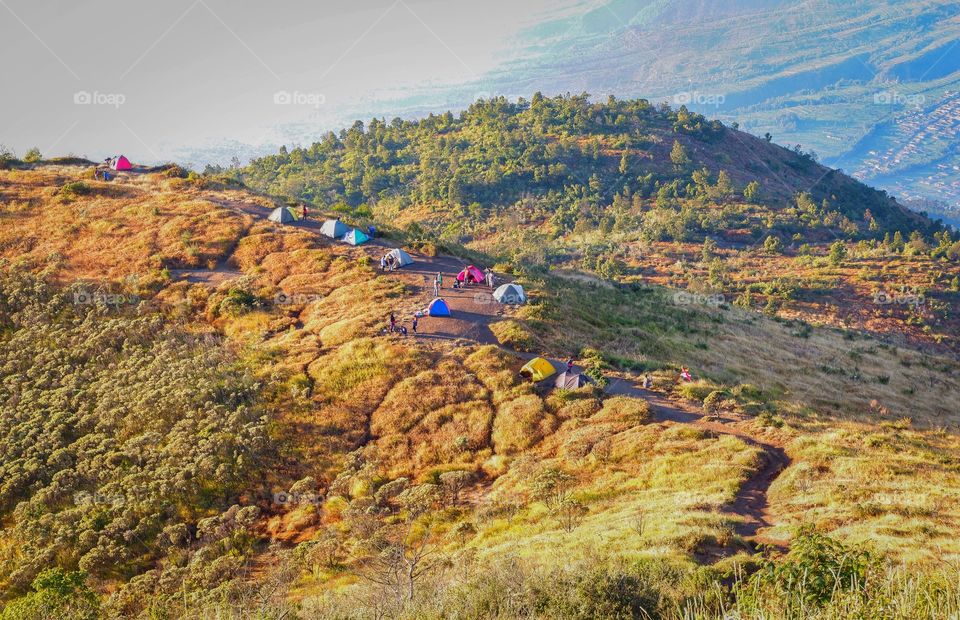 Backpackers camping at base of mountain at Indonesia 