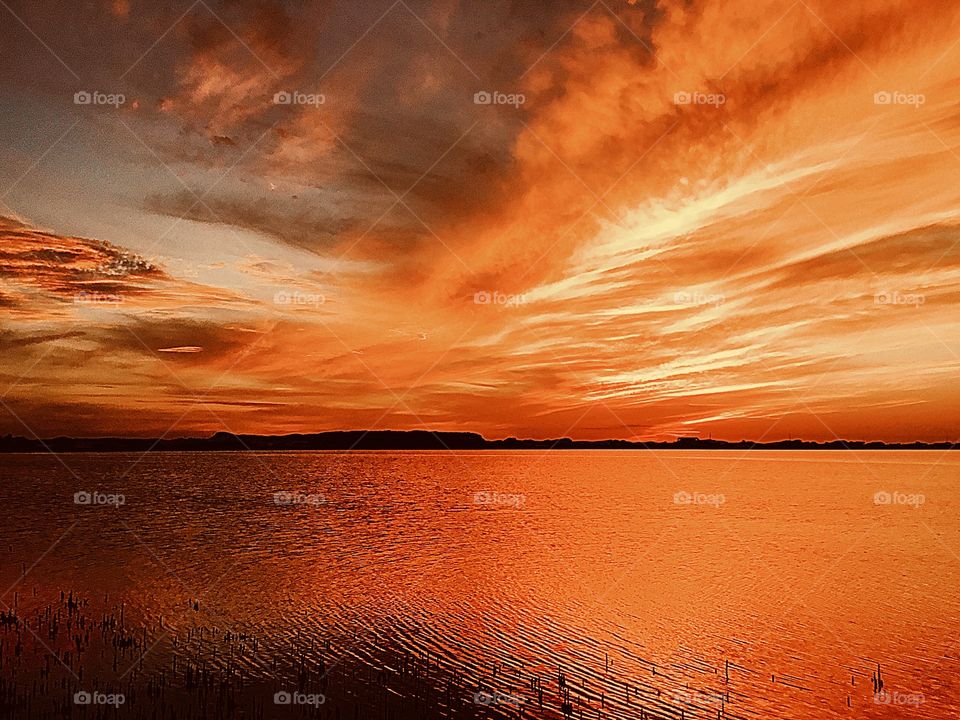 
The orange color stories. The vast, magnificent orange sunset. Sinking beneath the horizon, the threads of light lingered in the sky, mingling with the rolling clouds, dyeing the heavens bright orange. 
