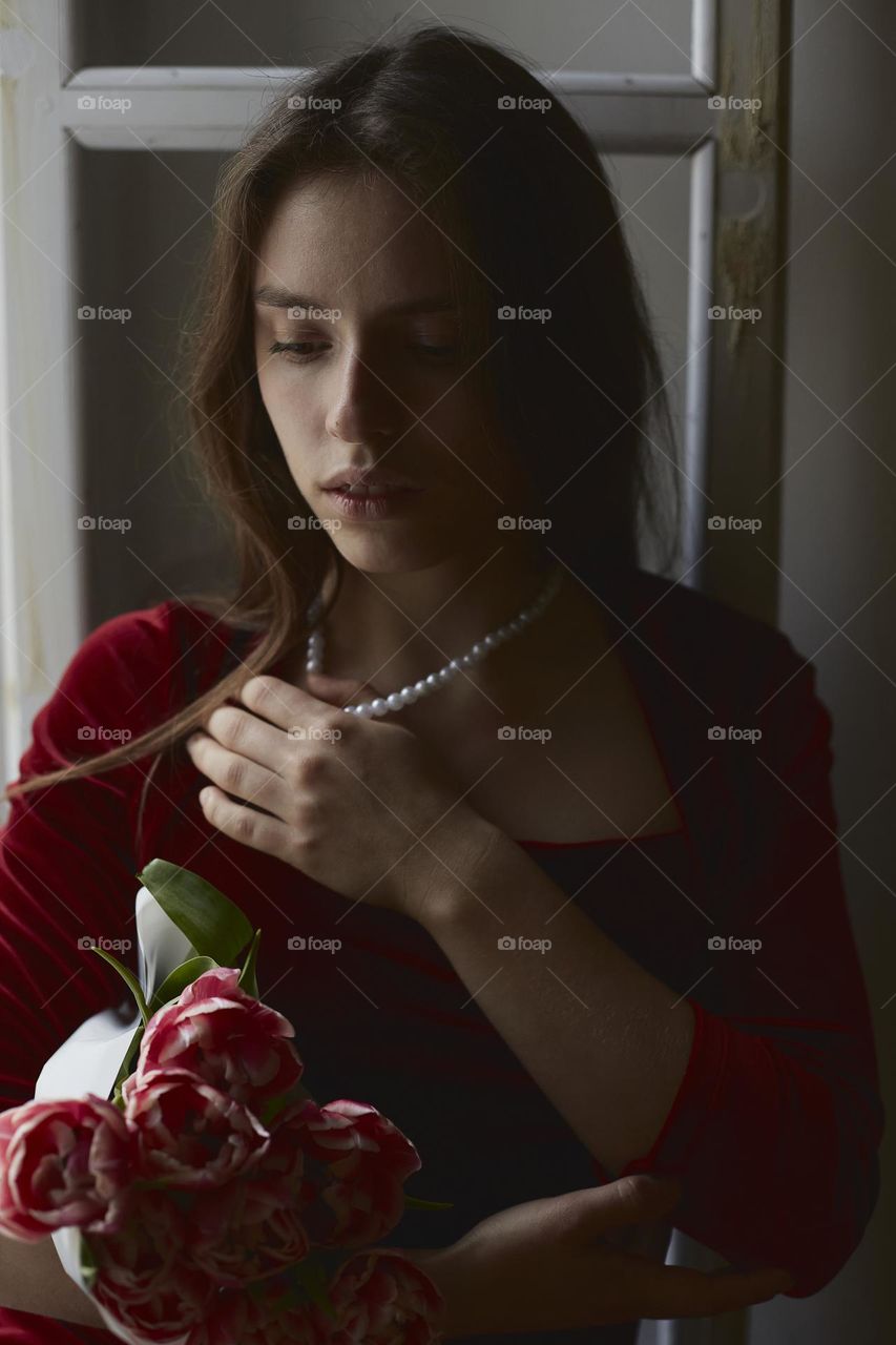 Beautiful girl with pearl necklace for recreation