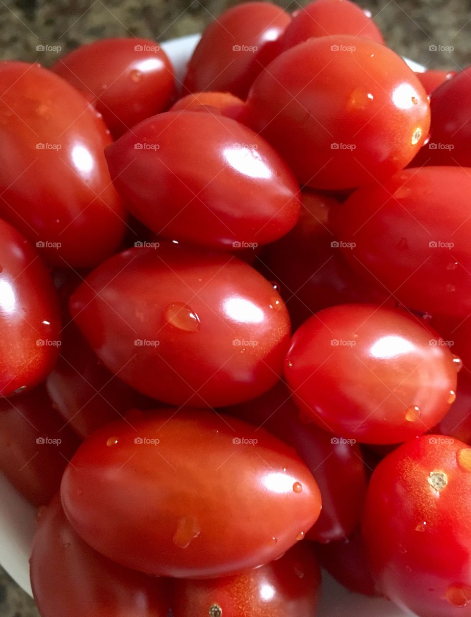 Grape Tomatoes in a pile and freshly washed.  