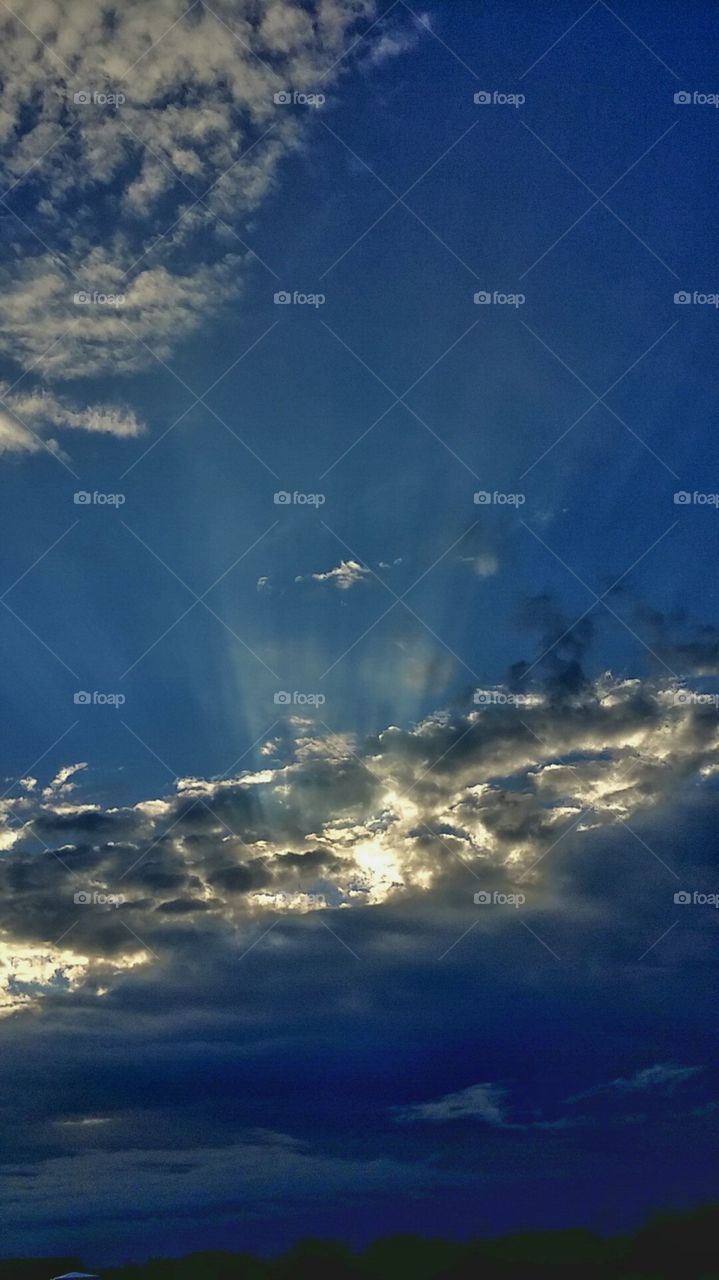 sun rays breaking through the clouds