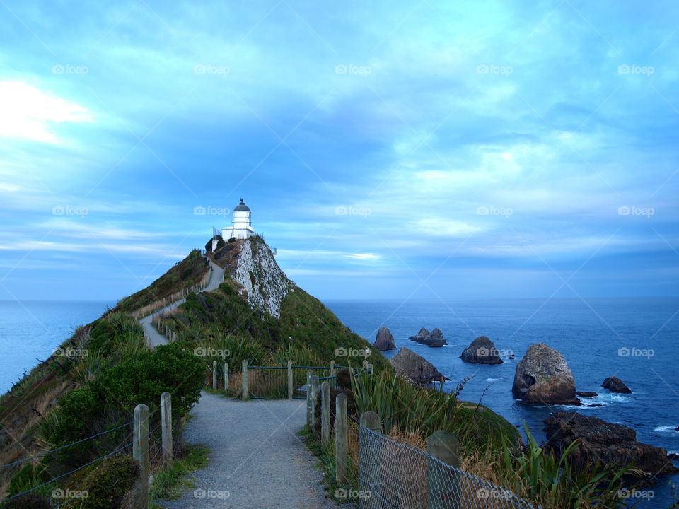 stormy clouds over the Nugget point lighthouse in new Zealand