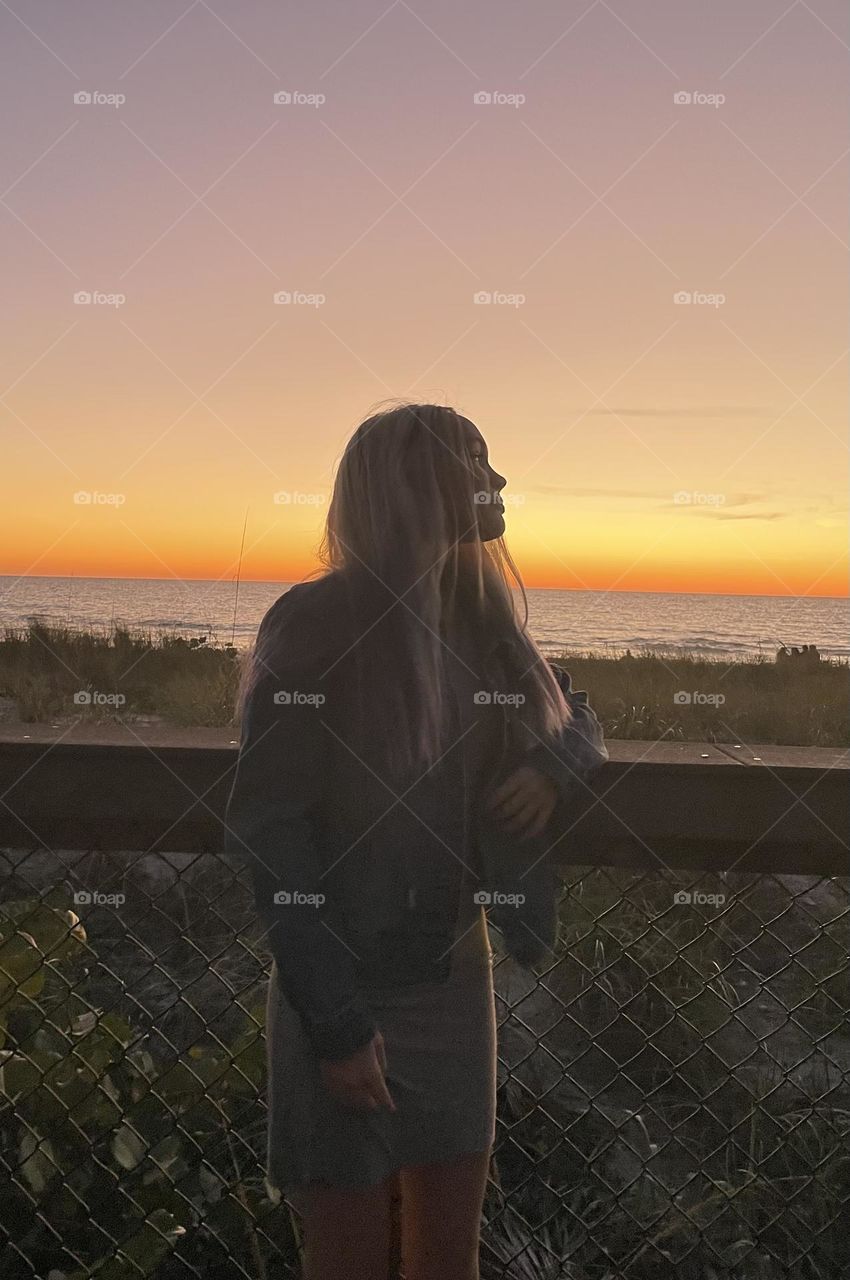 A photo of me with the sunset/beach background 