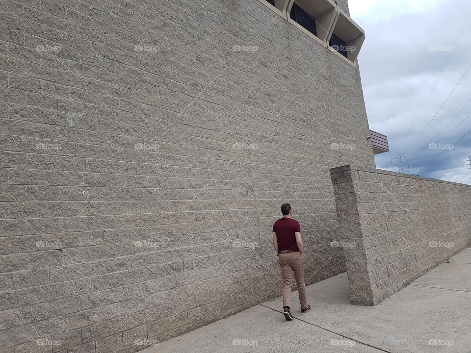 Man walking into building