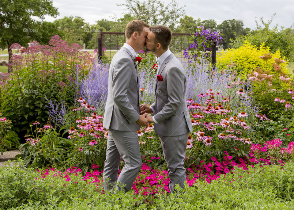 Gay kissing in the garden