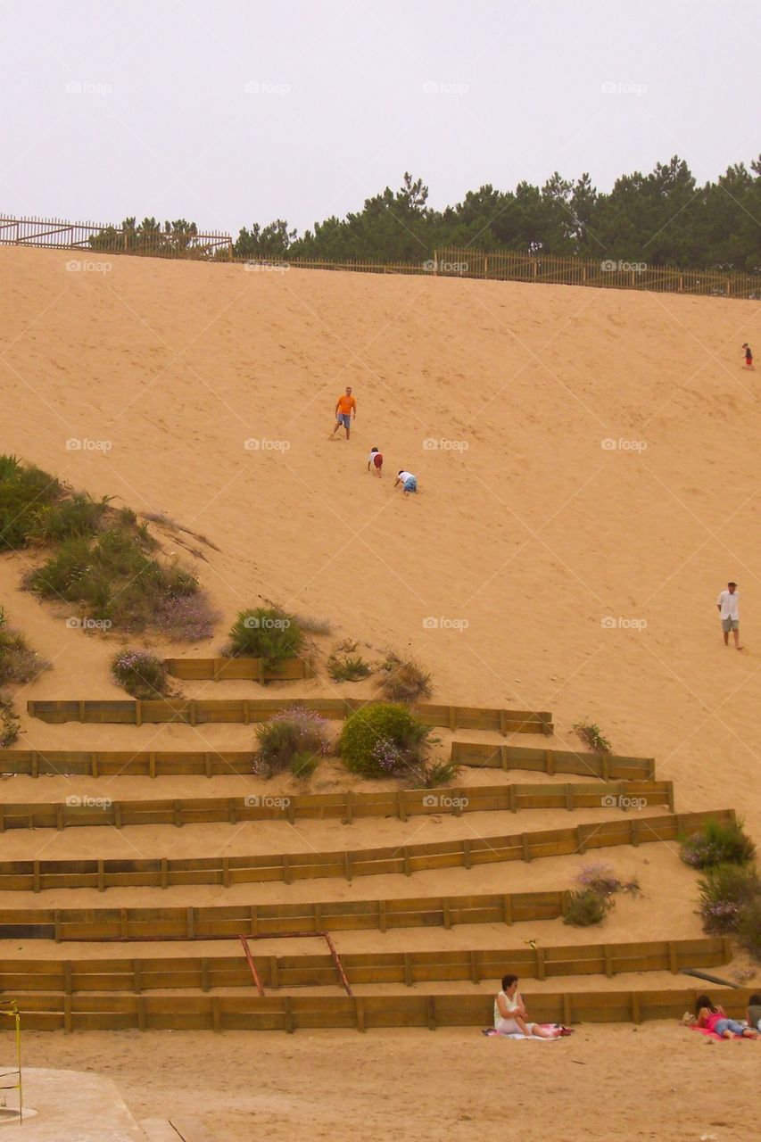 Rolling down beach sand dunes
