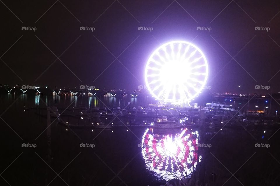 Ferris Wheel Reflecting Purple on the Potomac River
