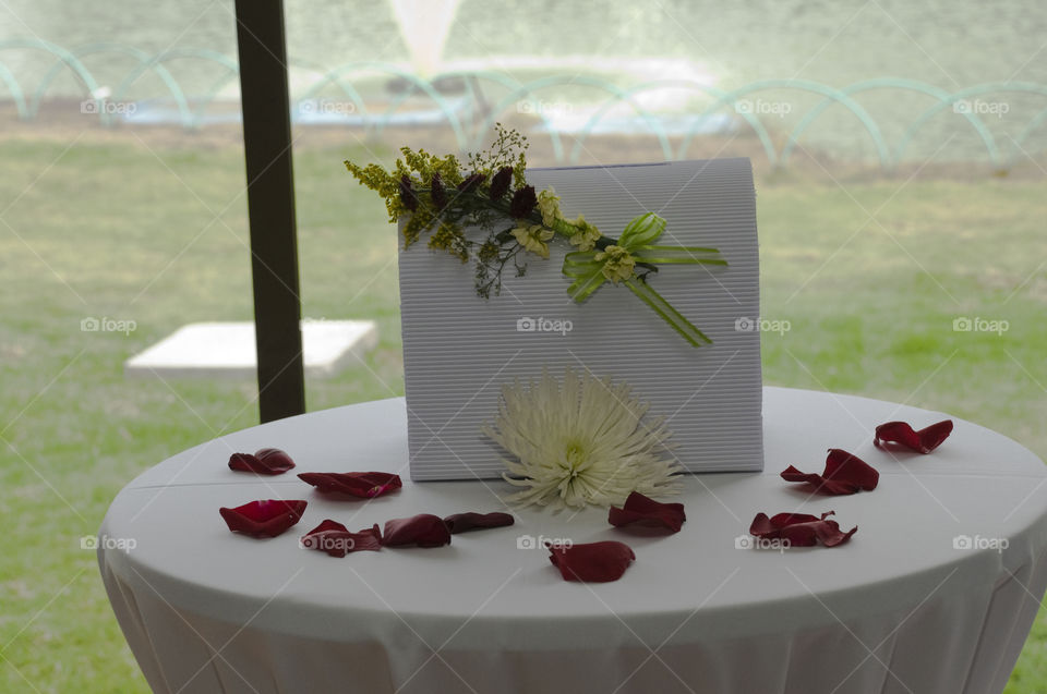 Gift envelope decorated with Flowers on table
