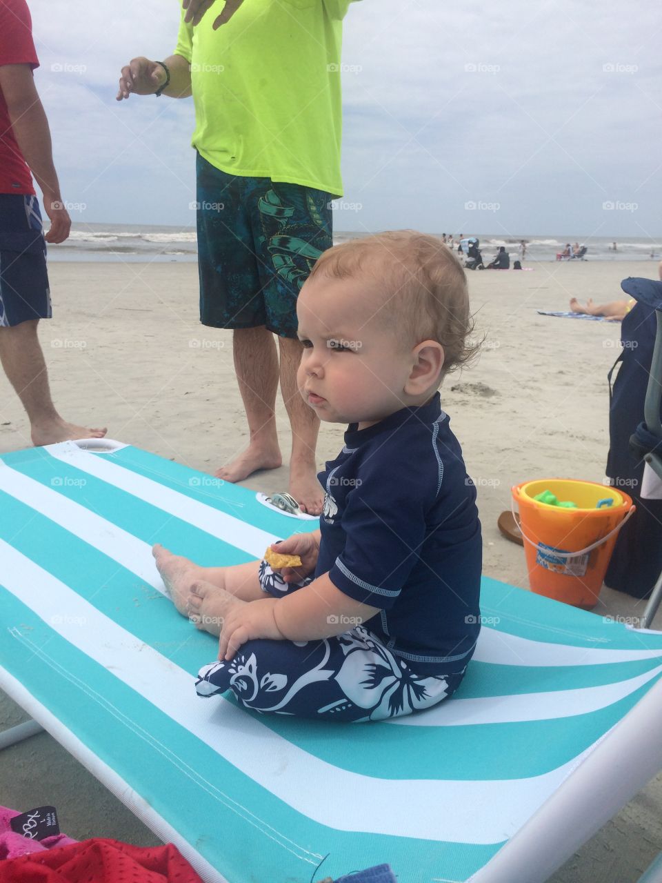 Child taking a snack break at the beach