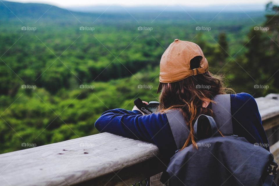 Cute girl taking landscapes of the gorgeous Porcupine Mountain. 