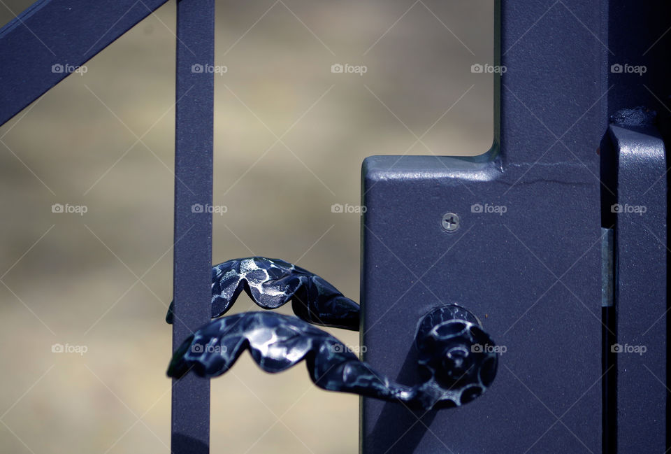 Closeup of gate handle at park in Berlin, Germany.