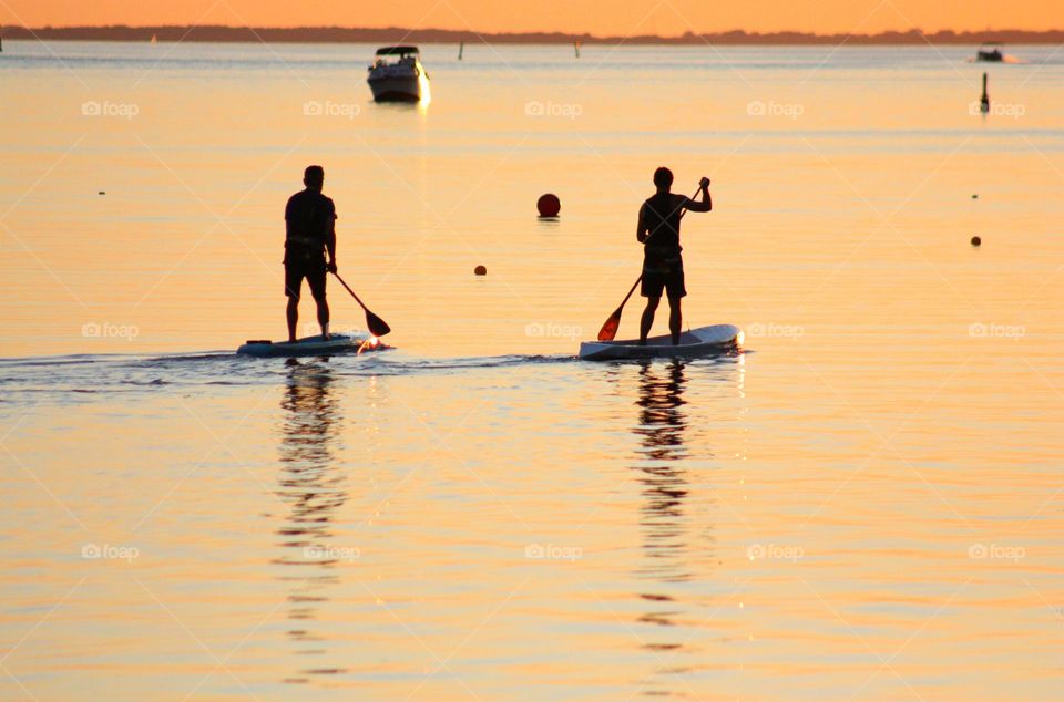 Men boating in water