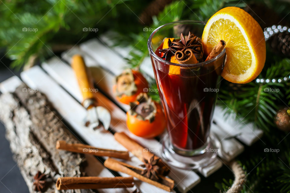 mulled wine and branches of a christmas tree
