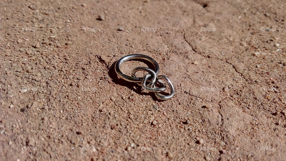 broken steel key chain on field