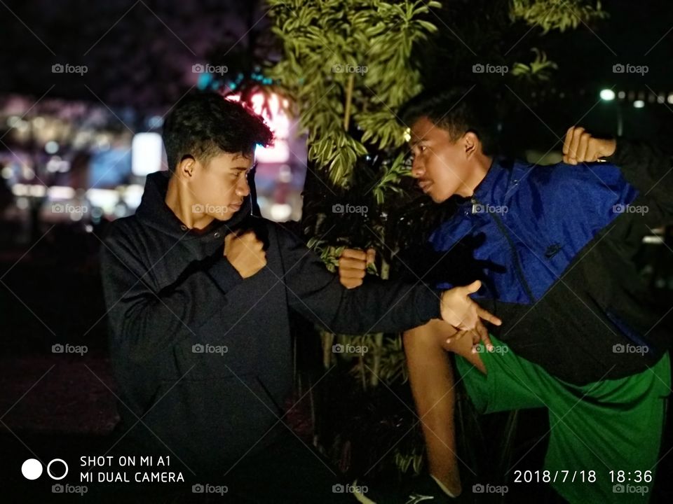 This scane is muay thai vs boxing MMA... I take this picture in taman depan metland indonesia.. This after maghrib.. So beatifull panorama.. Just feel the situasion and panorama that can make you enjoyed and feel deep.. Like you love some one people.