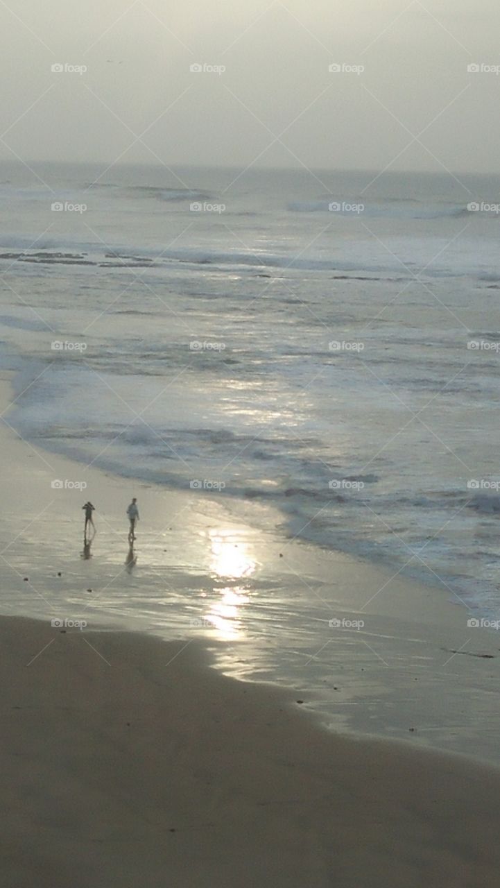 two brothers enjoy their best time near the beach.