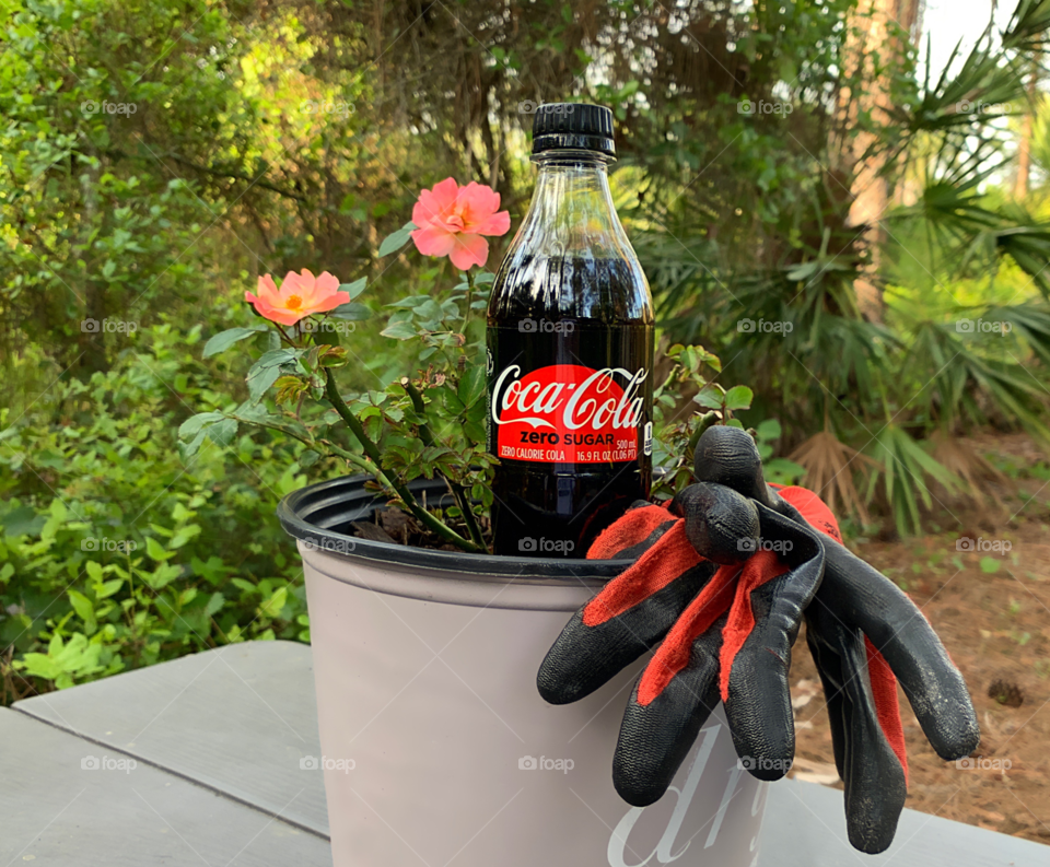 Gardening is even more relaxing with refreshing Coca Cola.