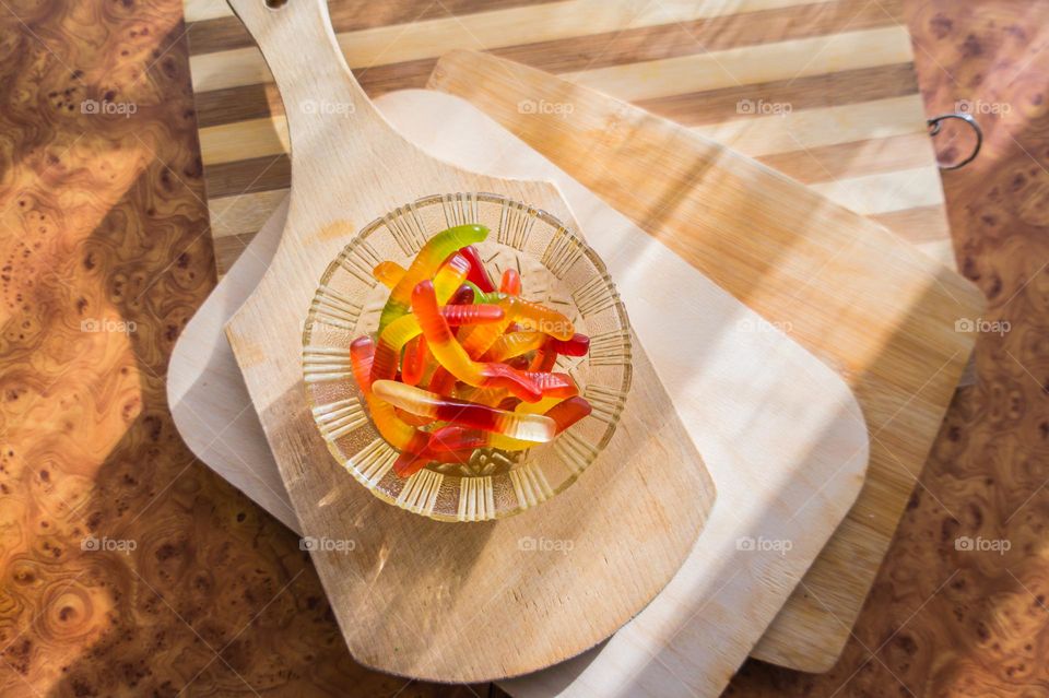 Jelly worms with sweet and sour taste. Sweets for children.