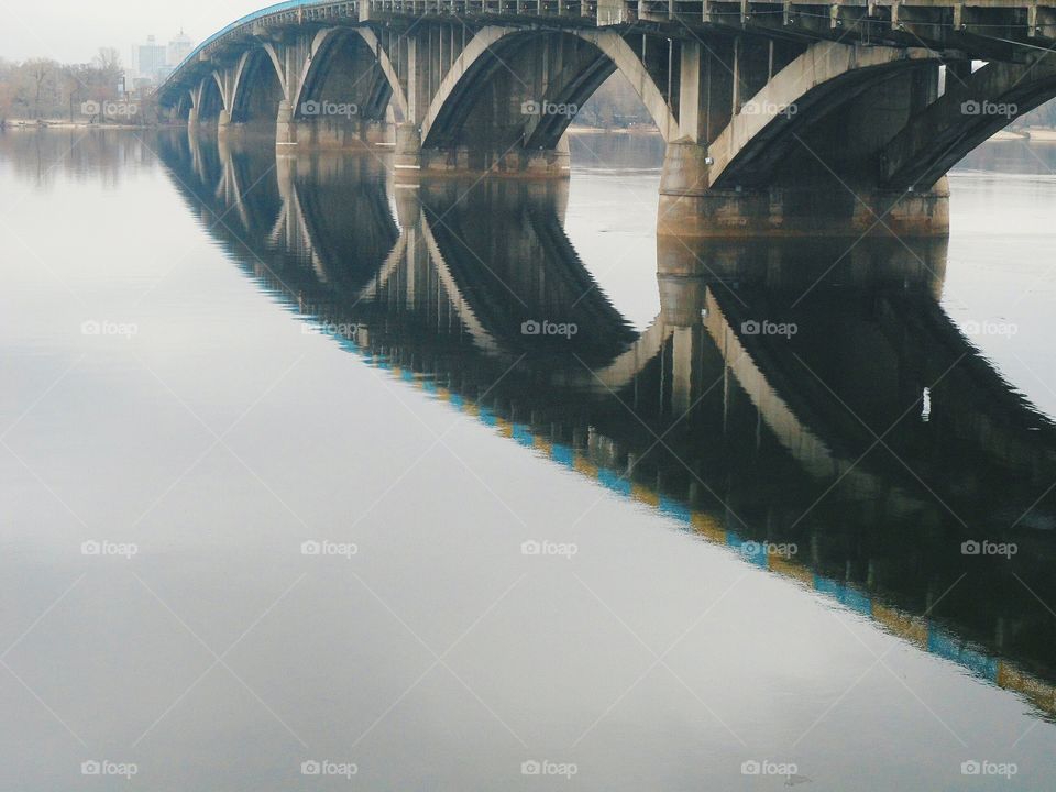 reflection of the bridge in river Dnepr