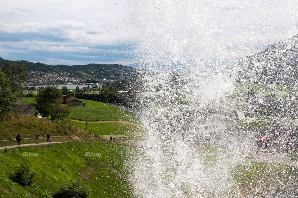 Behind the steinsdalsfossen waterfall with water splashing