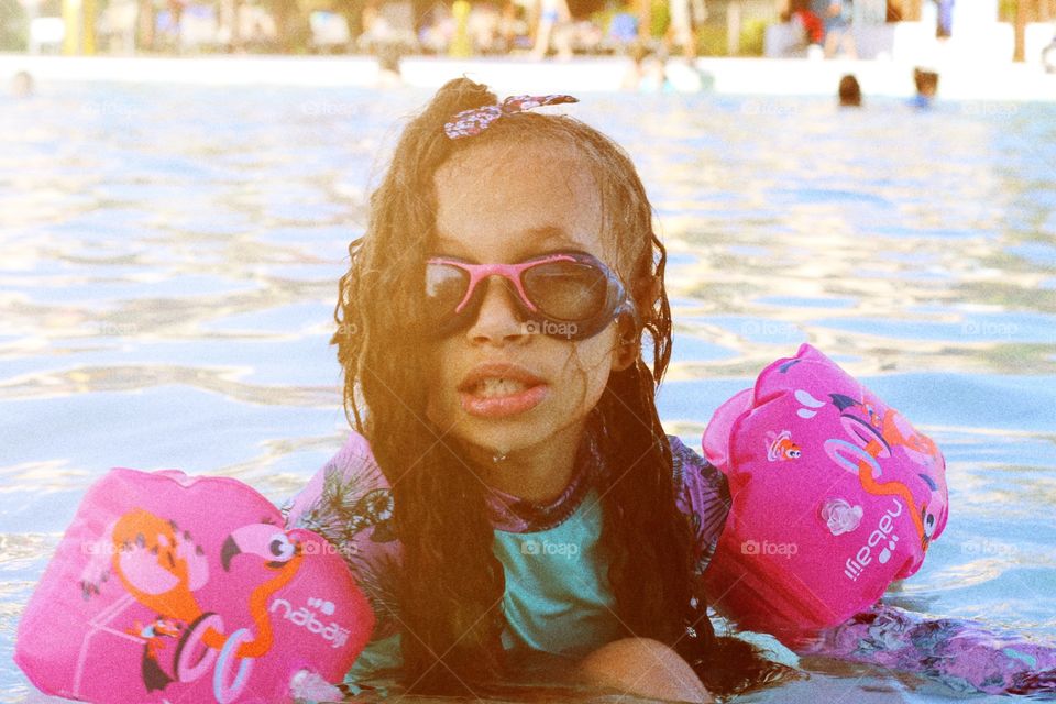 beautiful picture of little girl in the pool