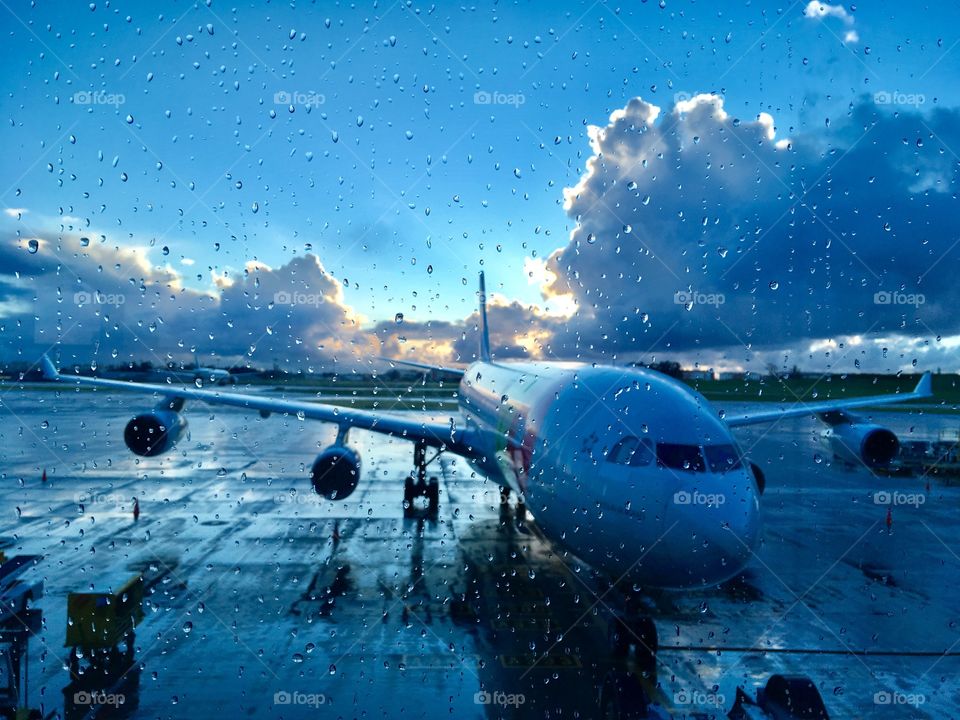 Airplane Reflection and rain in the city 