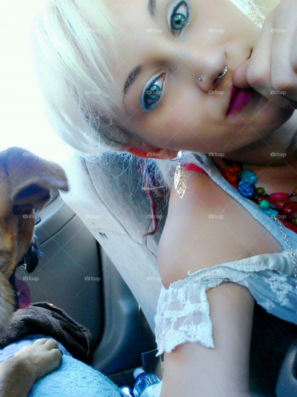 Girl and pup in the car