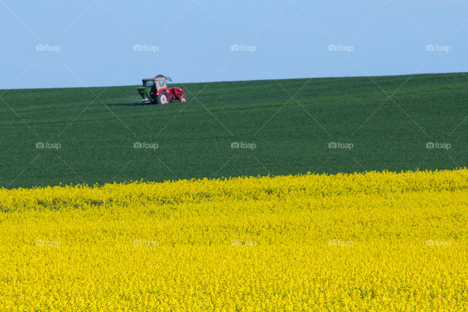 Tractor in agriculture field at Bavaria