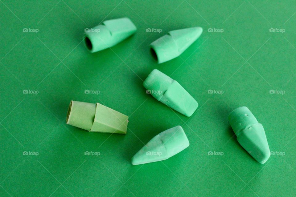 Green eraser with green background