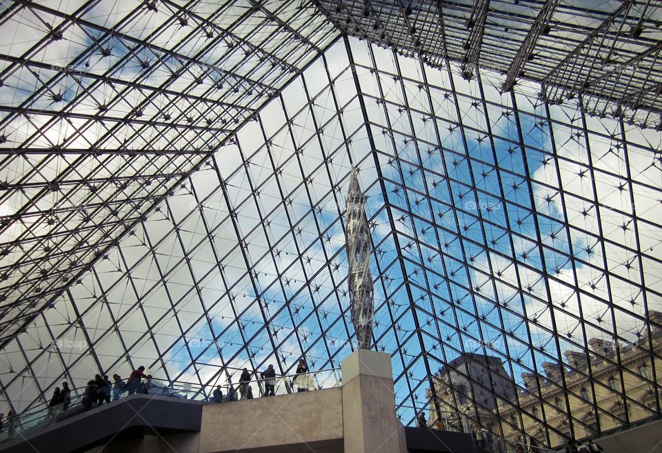 The Louvre in Paris France looking from the inside out of the famous pyramid