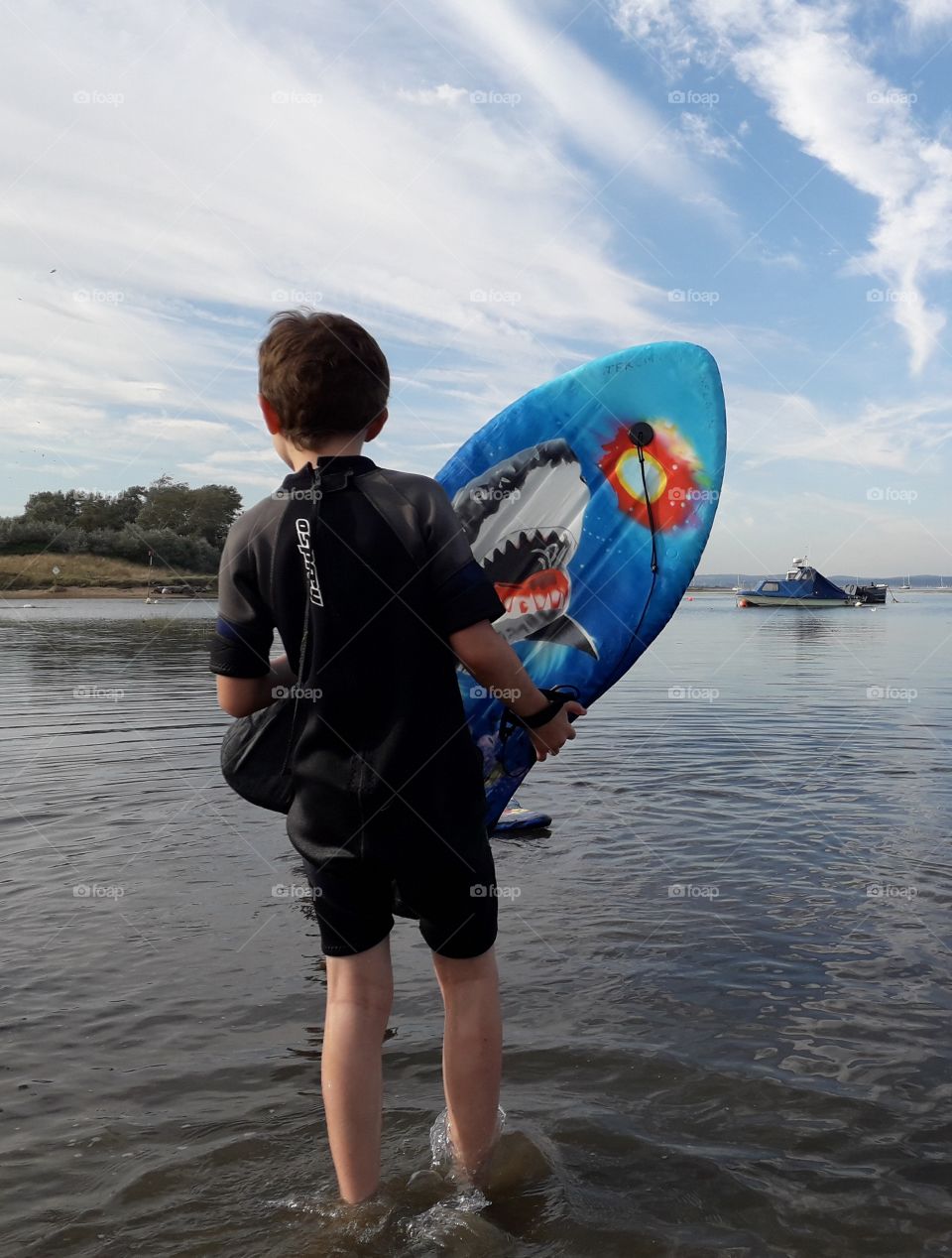 surfing boy at the seaside