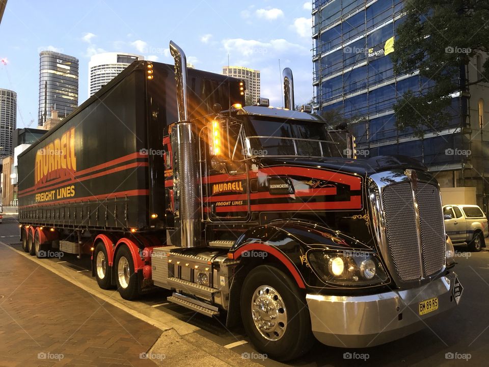 The big red and black shiny truck