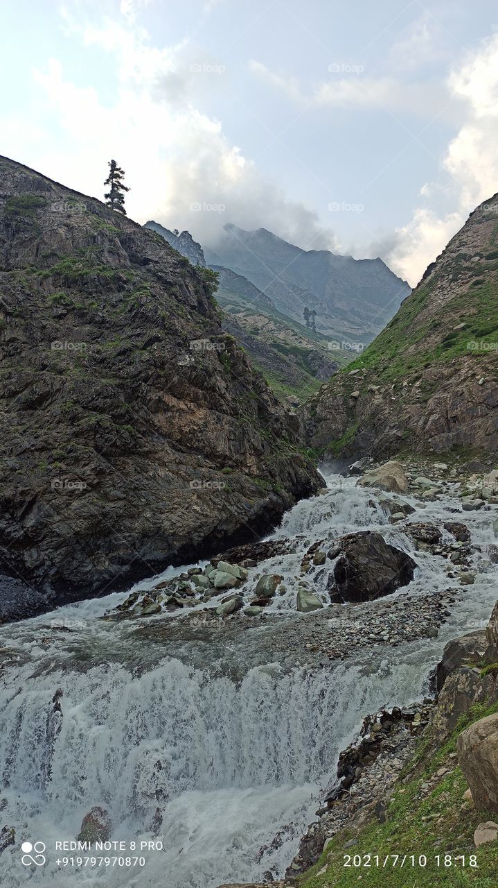 A beatiful scene of dancing Waterstream (emerging from nearby Mountains) on historic Mughal road near Zaznaar  spot -on Shopian side  in Summer 2021....