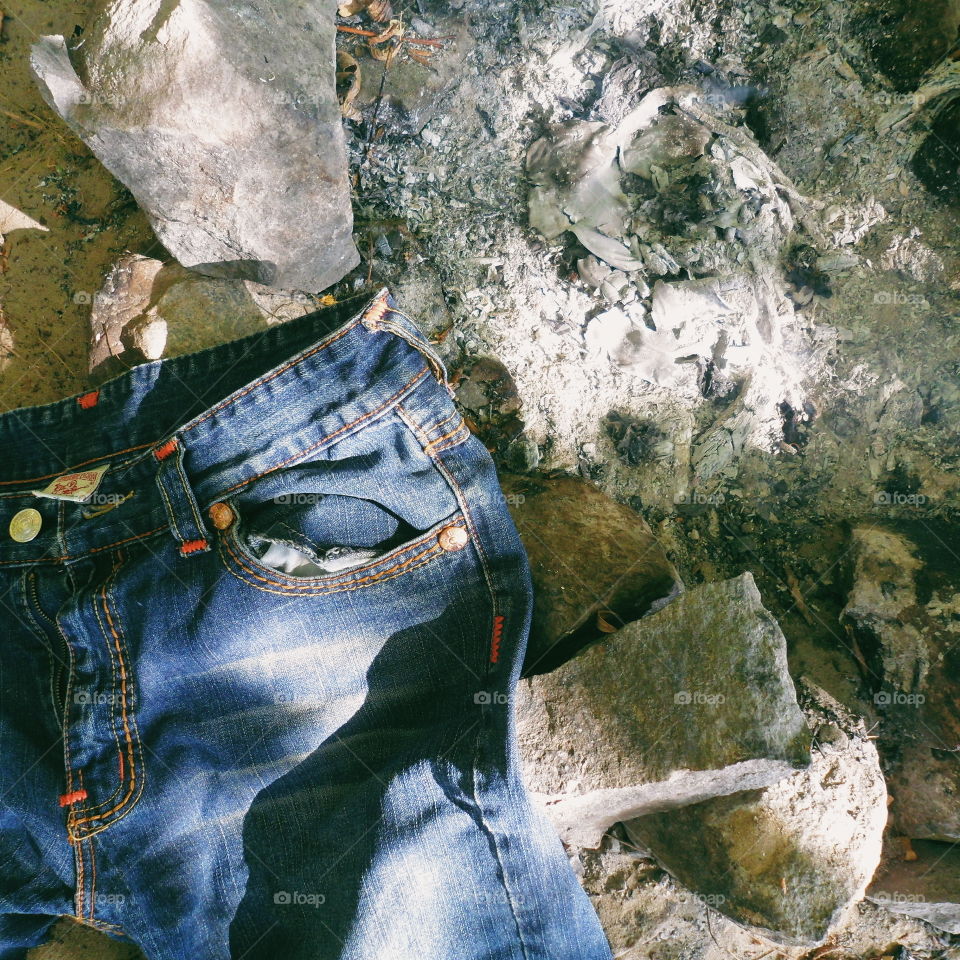 jeans lie near the extinct fire