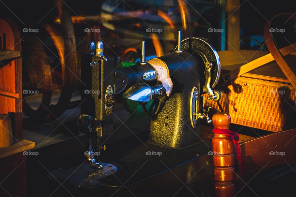 Old heavy sewing machine on display.