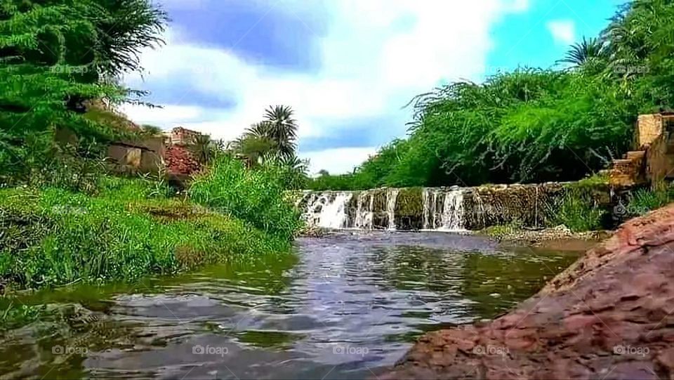Glory be to God, the magnificent and picturesque view and the natural green trees are a view that is nothing more wonderful than it