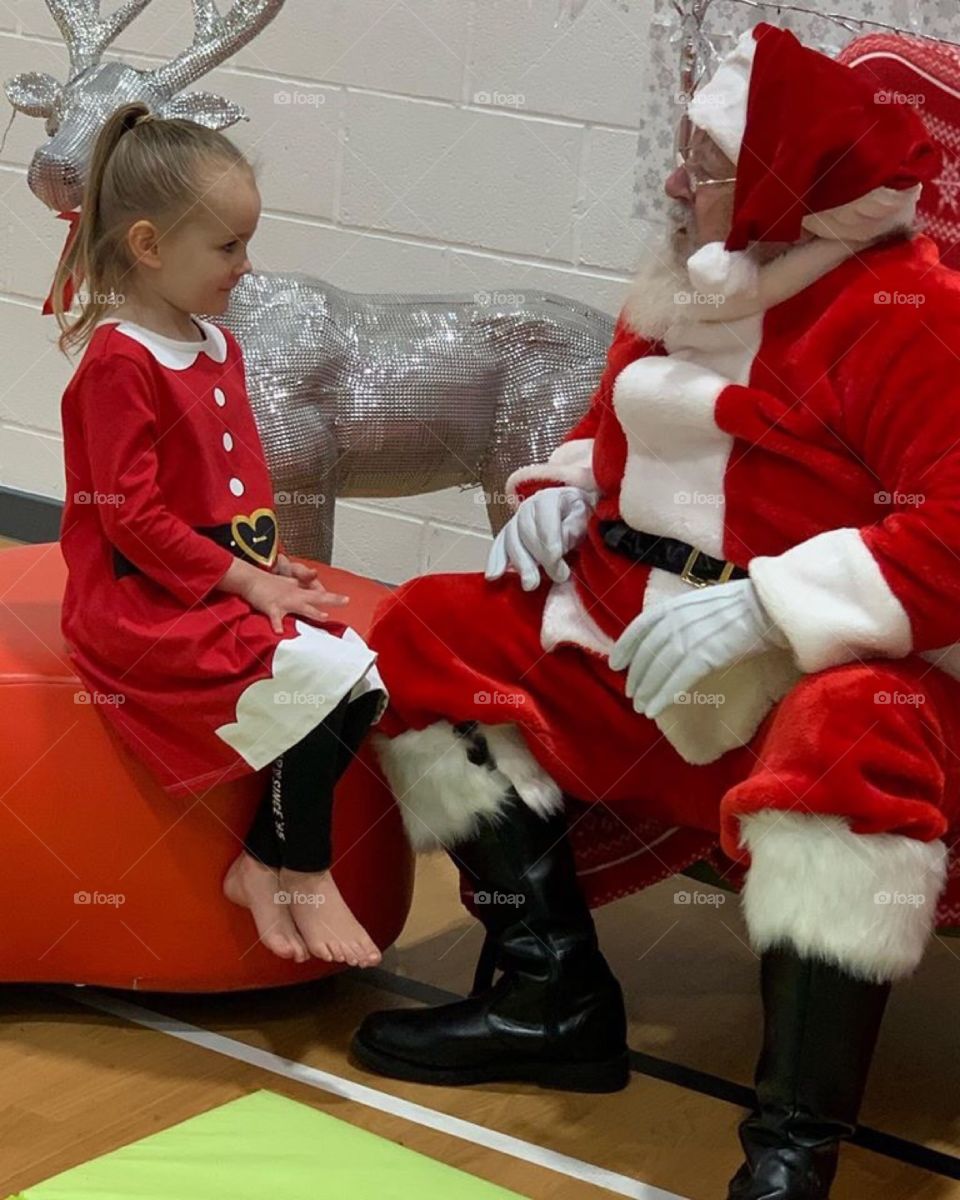 Little girl so interesting what Santa as to say to her