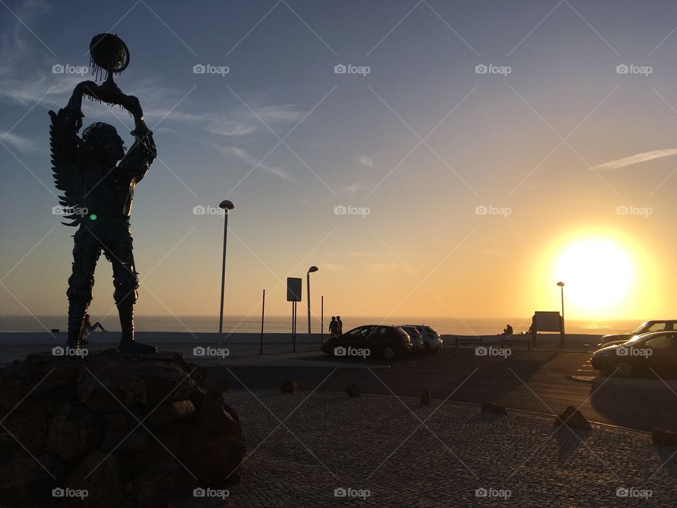 Metal statue sunset