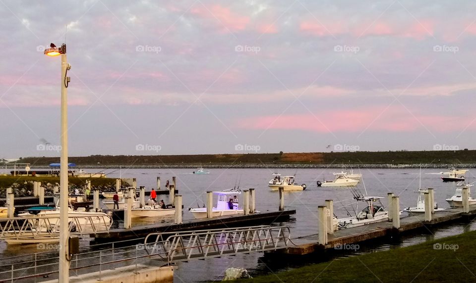 busy day at the port canaveral boat ramp. Dozens of boats trying to get am early start fishing for a tournament.