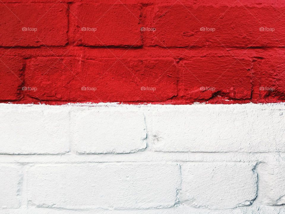 Red and white brick wall texture background looks like Indonesian flag