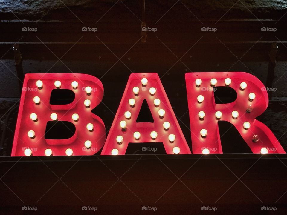 Bar sign in red lights
